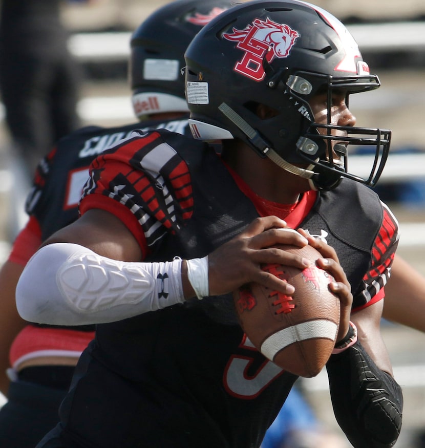 Mansfield Legacy quarterback Jalen Catalon (5) looks for a receiver during first quarter...