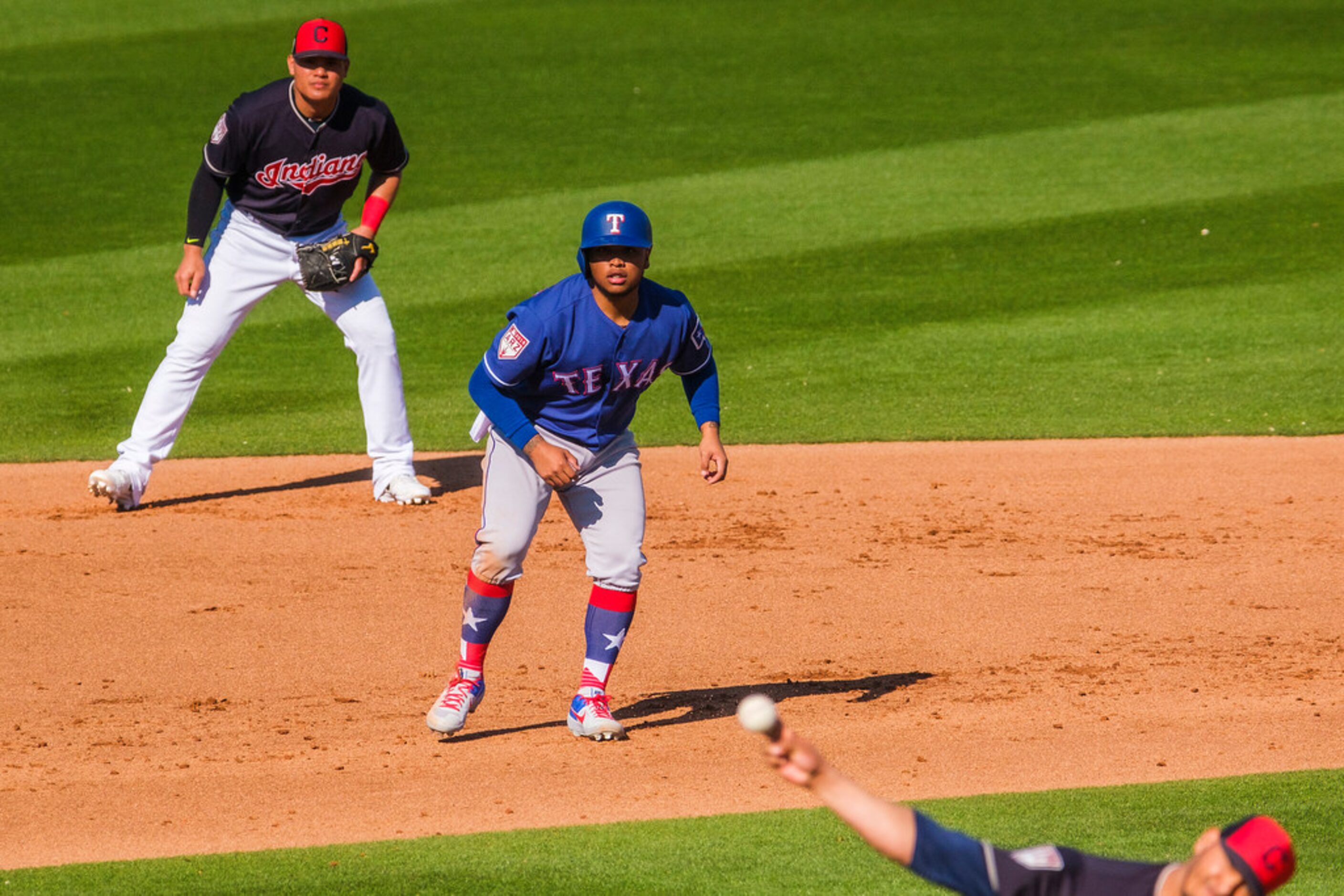 Texas Rangers outfielder Willie Calhoun takes a lead off second base after driving in two...