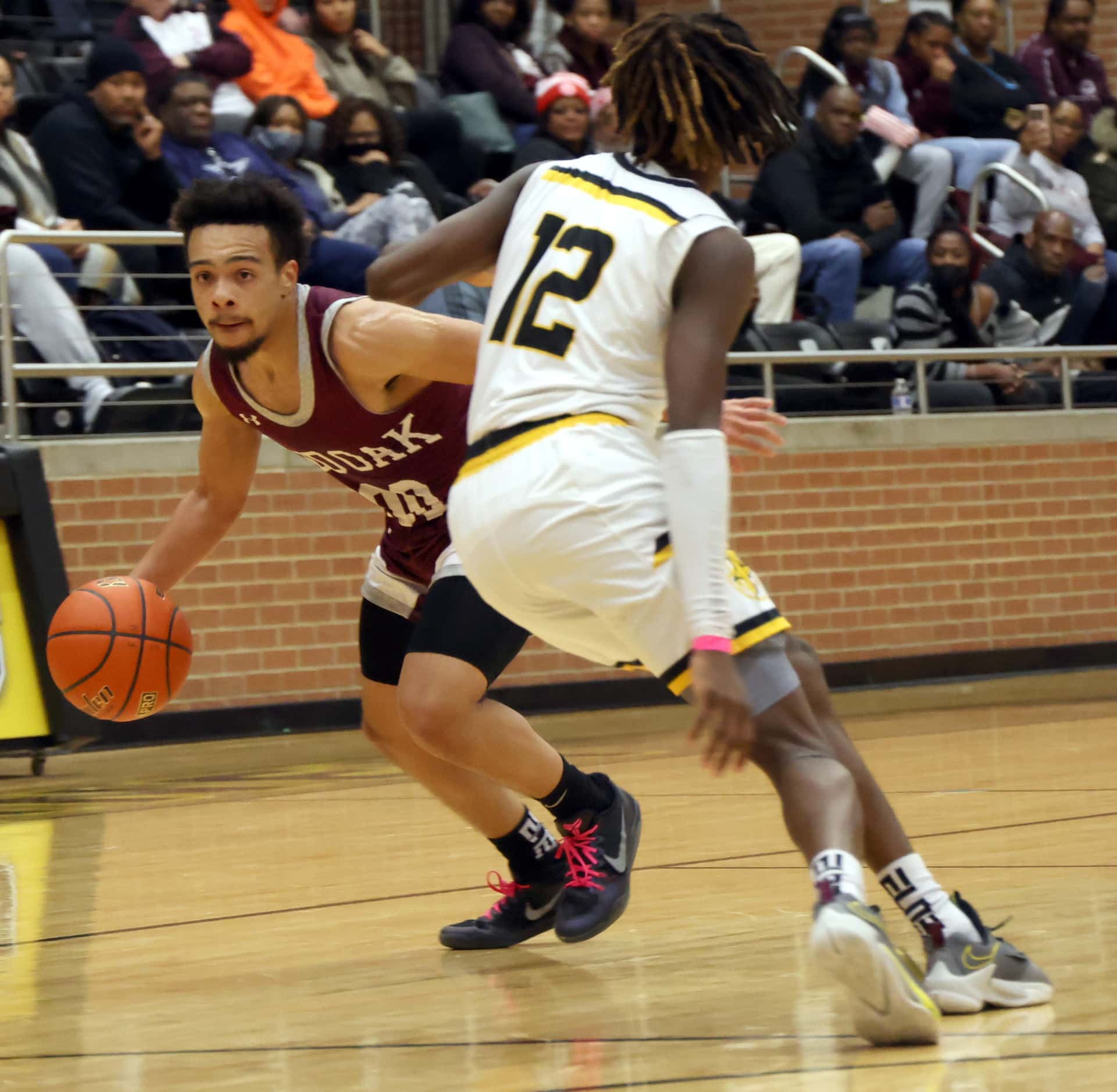 Red Oak guard Mark Broussard (00) drives the ball around the defense of Forney's Gernarius...