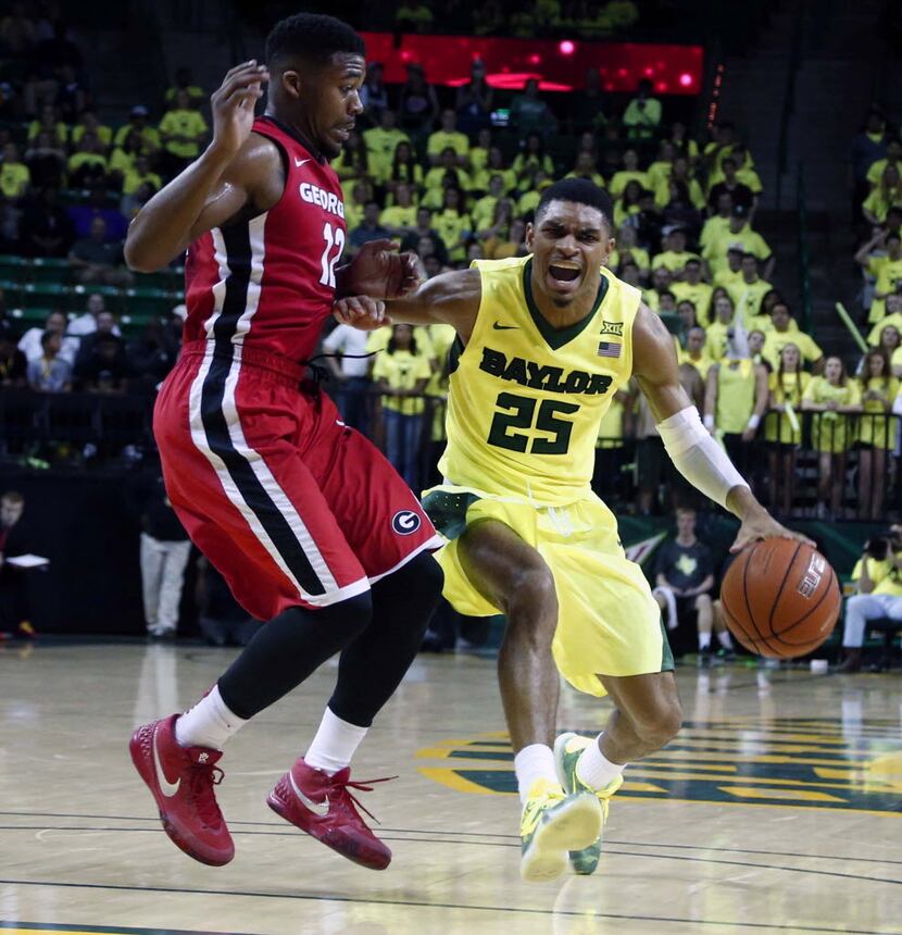Baylor guard Al Freeman (25) drives past Georgia guard Kenny Gaines (12) in the second half...