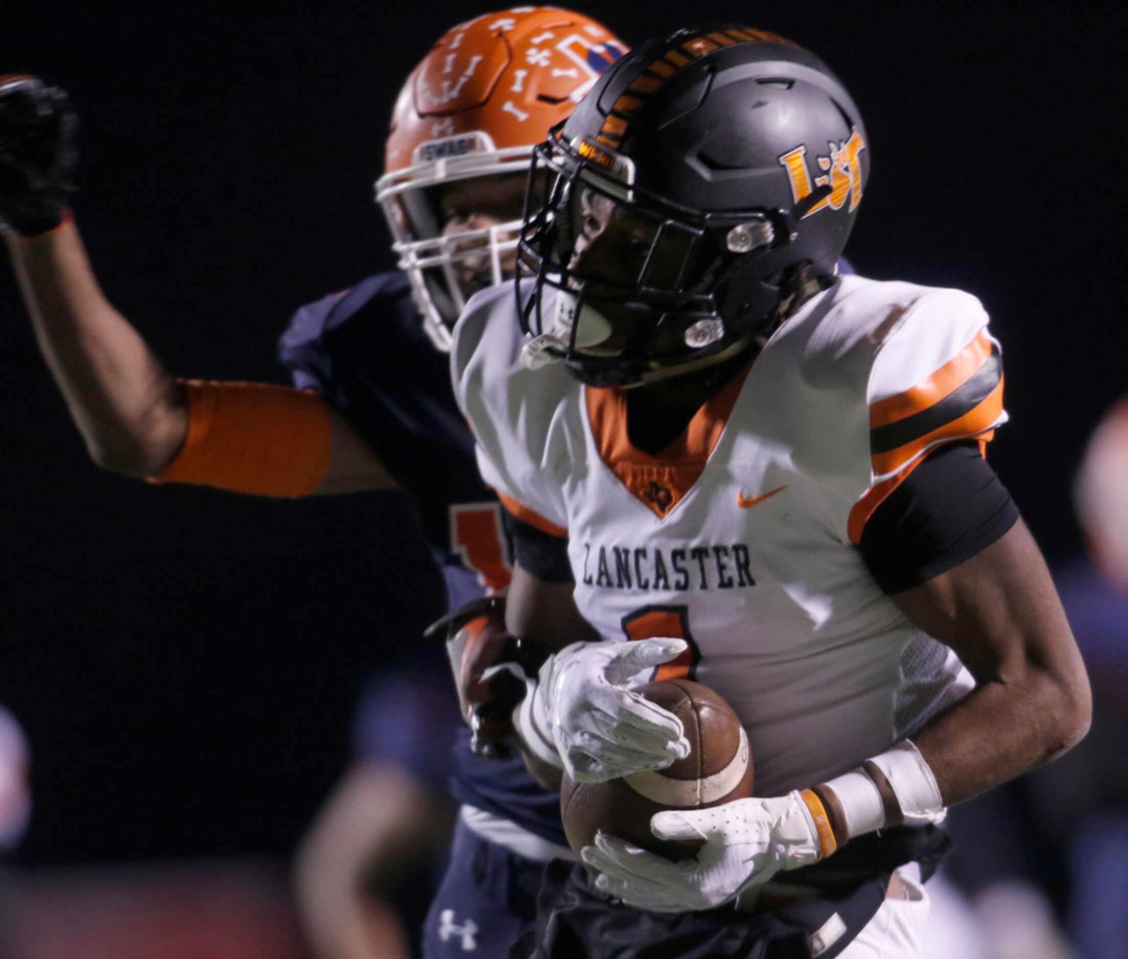 Lancaster receiver LaTrell Caples (1) rambles past McKinney North defensive lineman Ethyn...