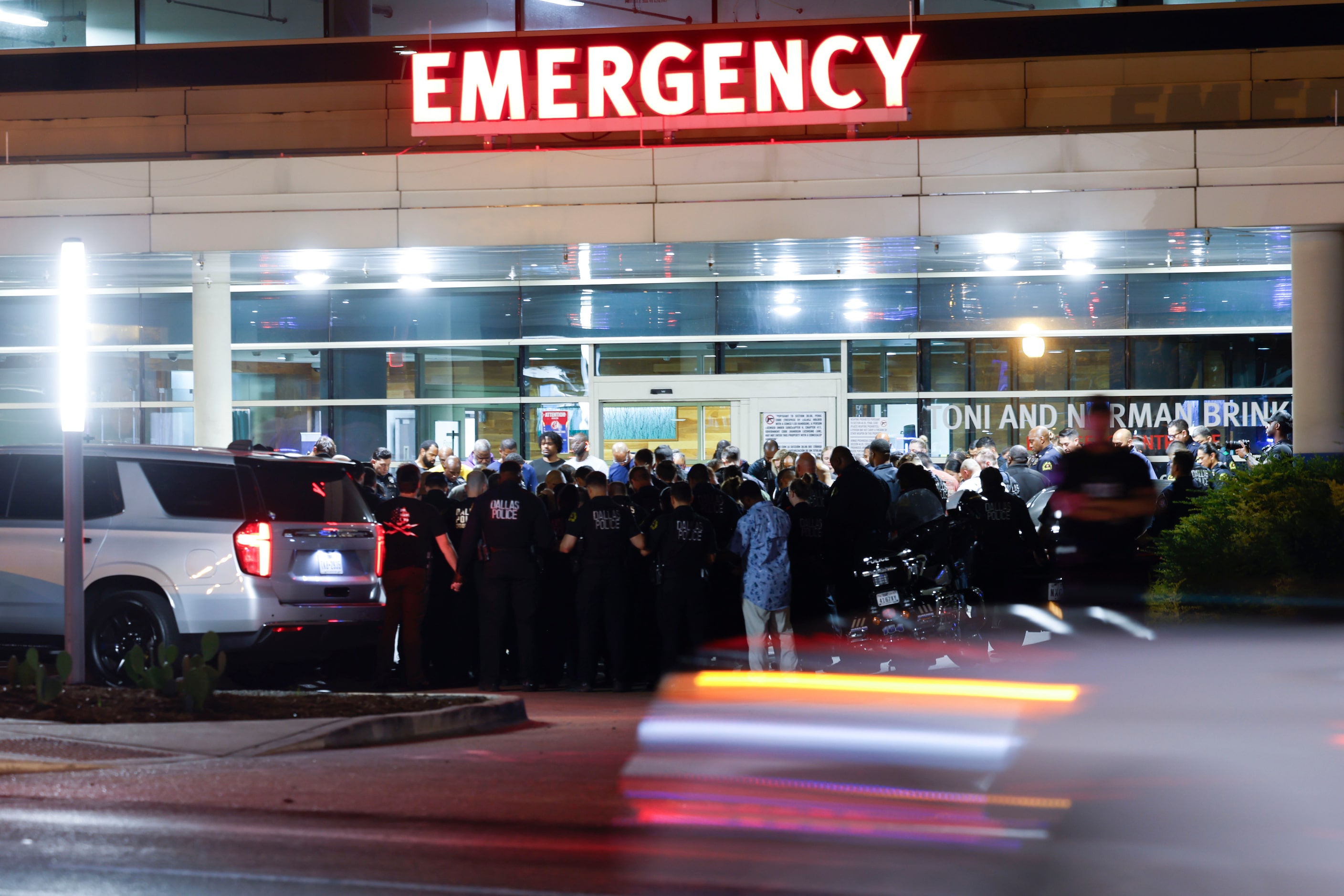 Dallas Police Department officers and family members o the deceased Dallas Police officer...