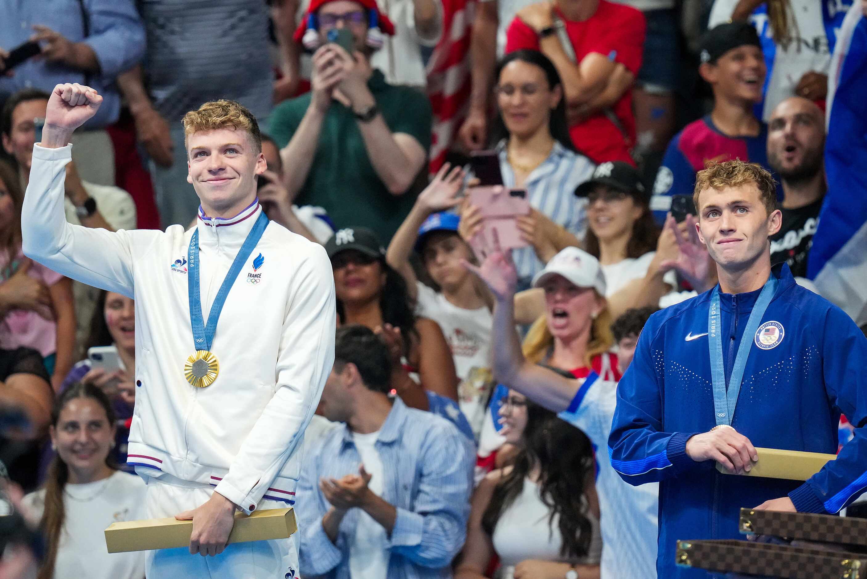 Gold medalist Leon Marchand (left) of France stands with bronze medalist Carson Foster of...