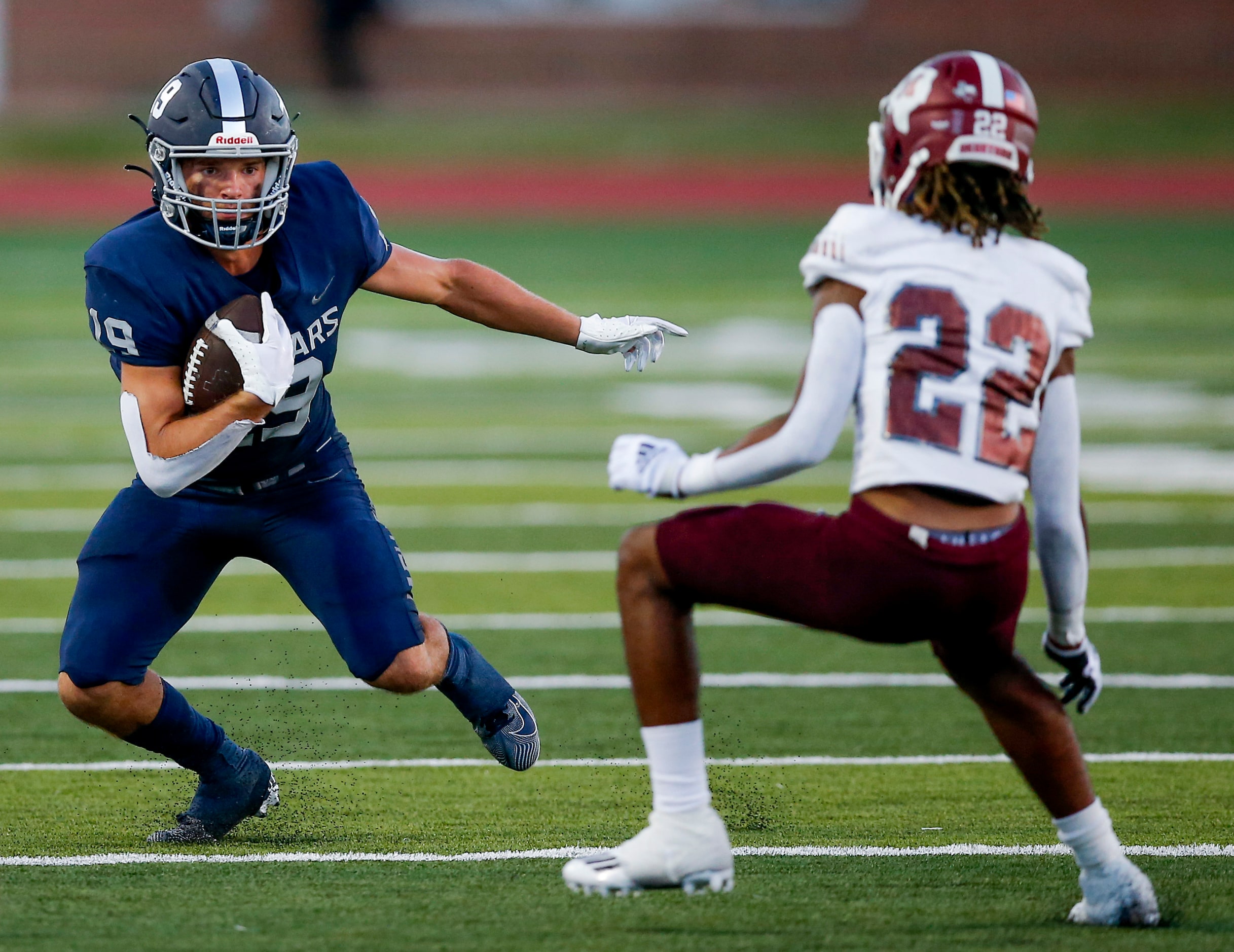 Flower Mound senior wide receiver Cade Edlein (19) looks for room against Mesquite junior...