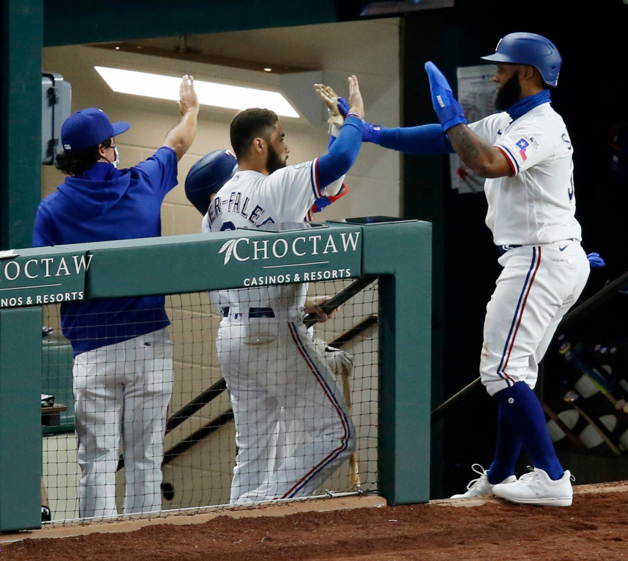 Texas Rangers second baseman Danny Santana (38) celebrates with Texas Rangers third baseman...