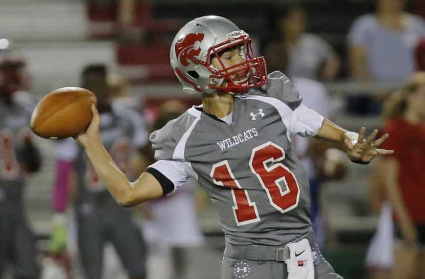 TXHSFB Woodrow Wilson sophomore quarterback Case Fennegan (16) looks to pass during the...