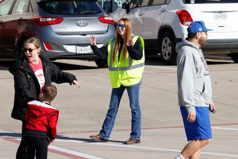 Aliza Capen greets a group of volunteers during their annual Thanksgiving meal giveaway...