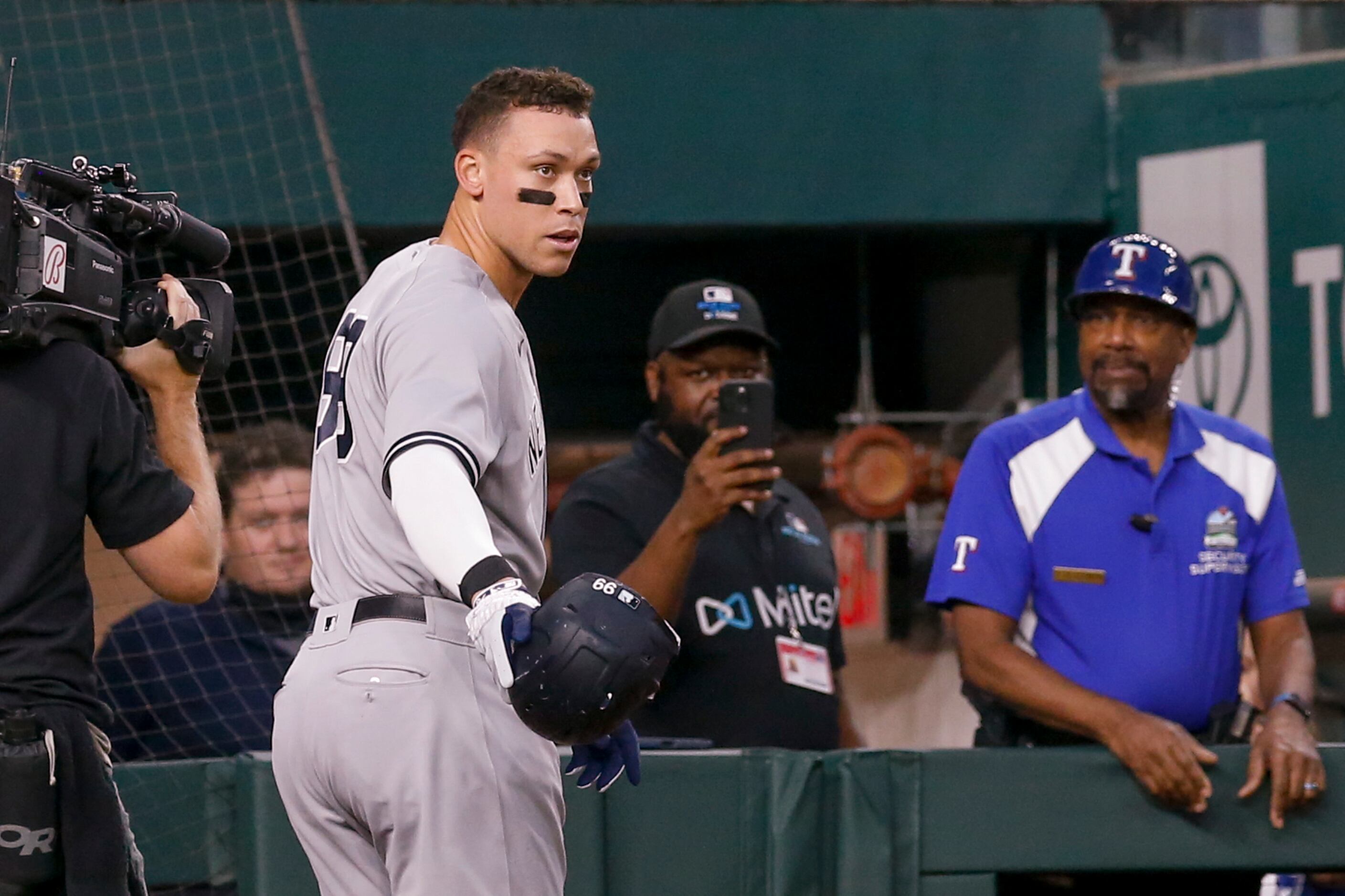 New York Yankees right fielder Aaron Judge (99) tips his hat to the crowd after hitting his...