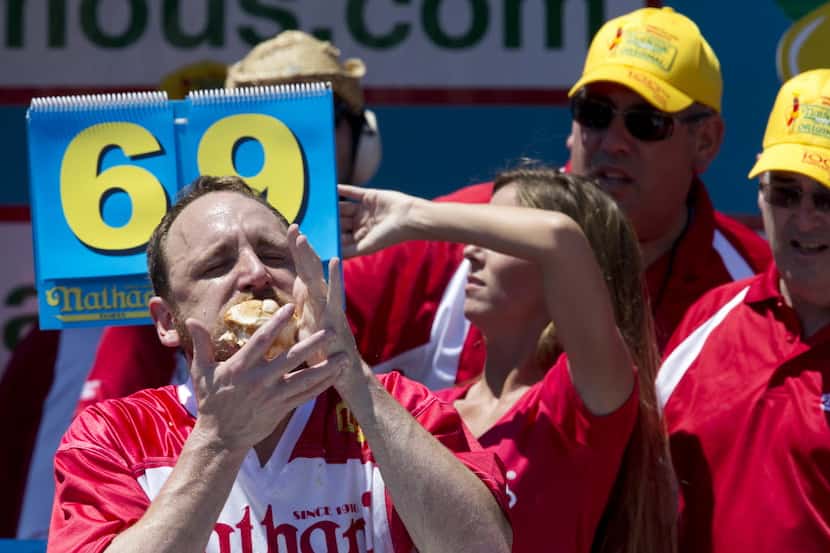 Joey Chestnut competes in Nathan's Famous Fourth of July International Hot Dog Eating...