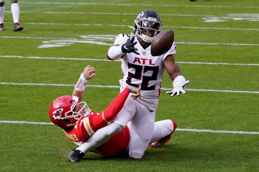 A pass intended for Kansas City Chiefs quarterback Patrick Mahomes is intercepted by Atlanta...