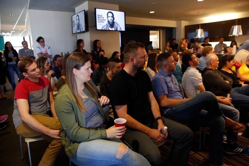 Staffers at The Marketing Arm listen during a Q&A with Young Guru at the firm in Dallas....