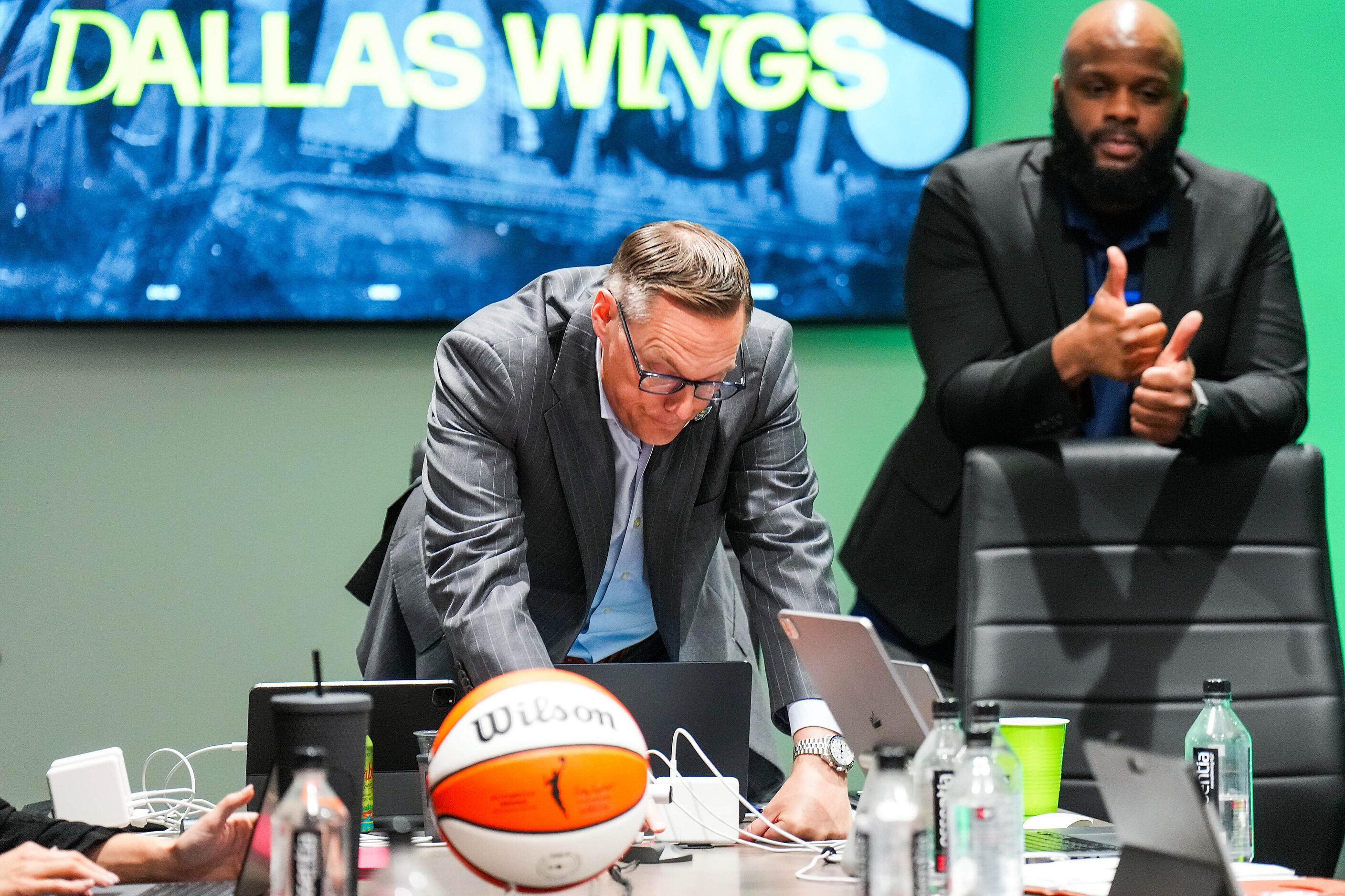 Dallas Wings President and CEO Greg Bibb gets a thumbs up from assistant general manager...