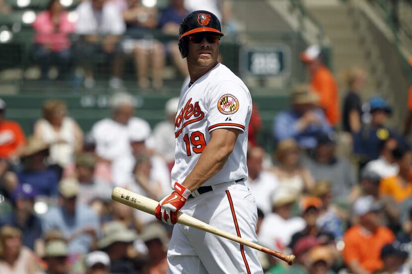 Mar 15, 2014; Sarasota, FL, USA; Baltimore Orioles first baseman Chris Davis (19) walks to...