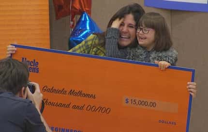 Gabriela Malkomes and her mother, Luciana Malkomes, celebrate winning $15,000 in a contest...