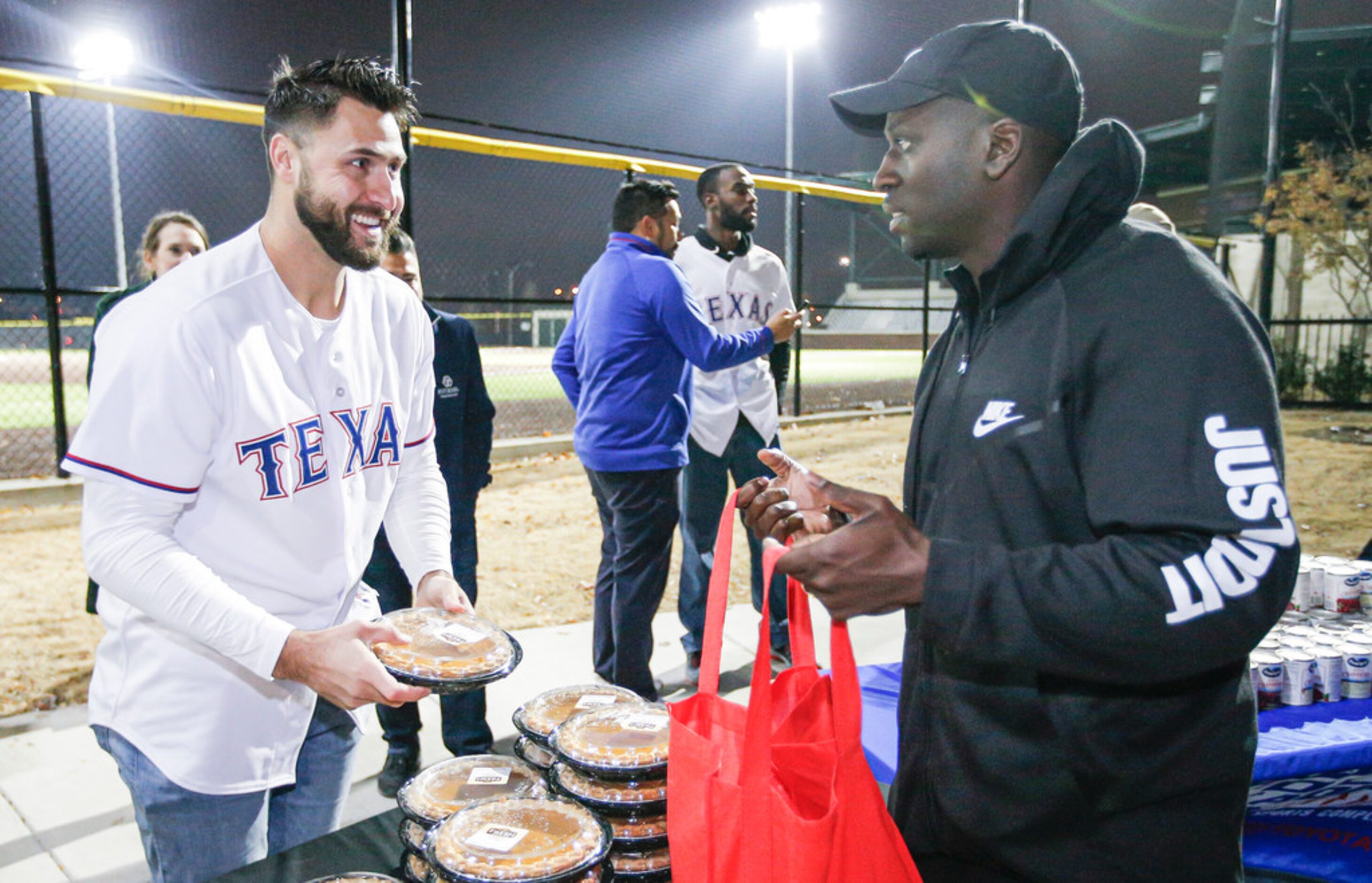 Texas RangersÃ Joey Gallo hands out a pumpkin pie to Dederick Tubbs at the Texas Rangers...