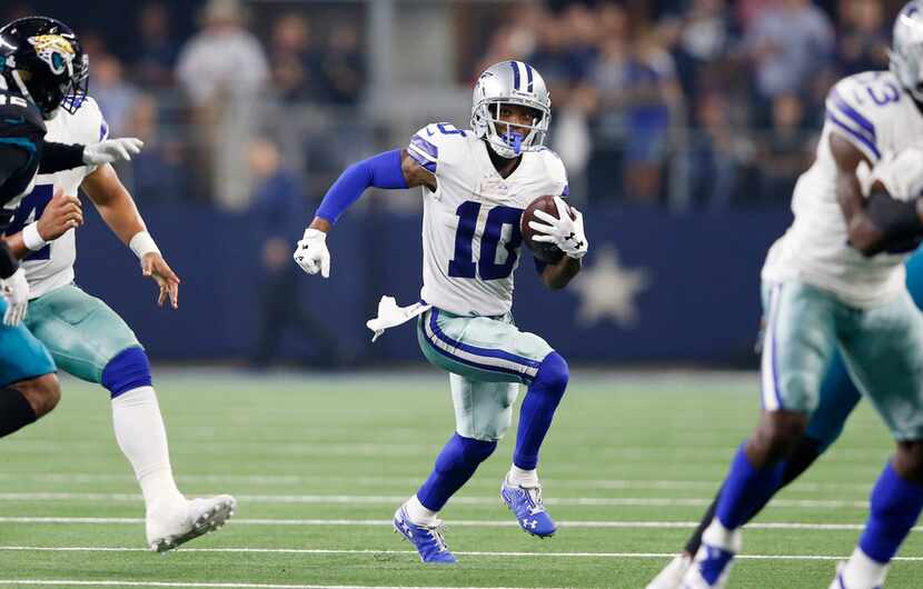 Dallas Cowboys wide receiver Tavon Austin (10) runs up the field on an end around play in a...