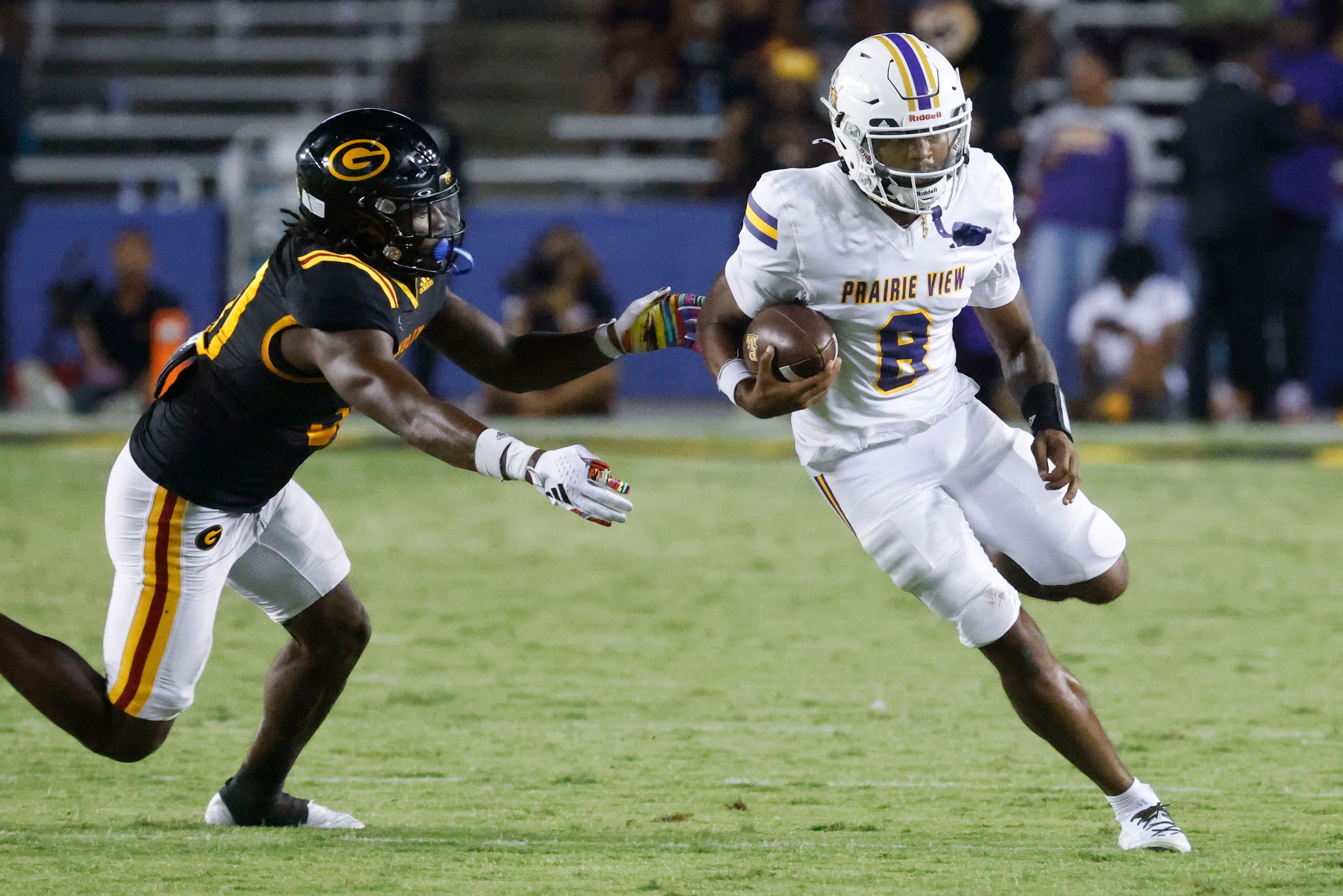 Grambling State linebacker Brenden Barley (left) reaches to stop Prairie View A&M...