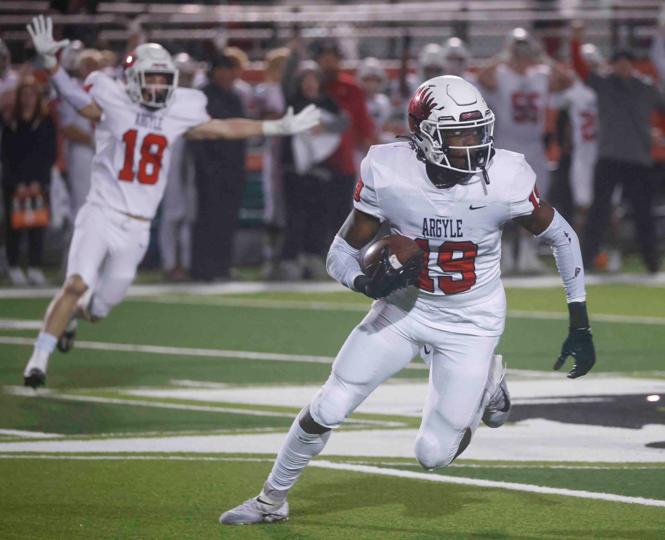 Argyle High’s Jaaqwan Felton (19) runs after he intercepts a pass against Grapevine High...