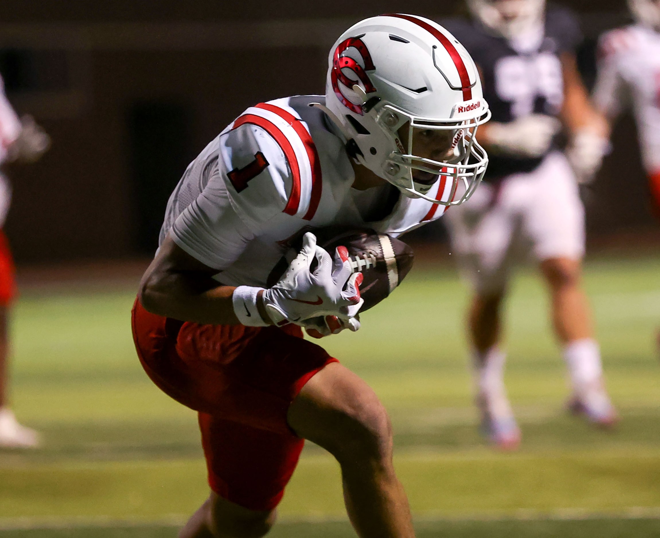 Coppell wide receiver Tucker Cusano (1) comes up with a 17 yard touchdown reception against...