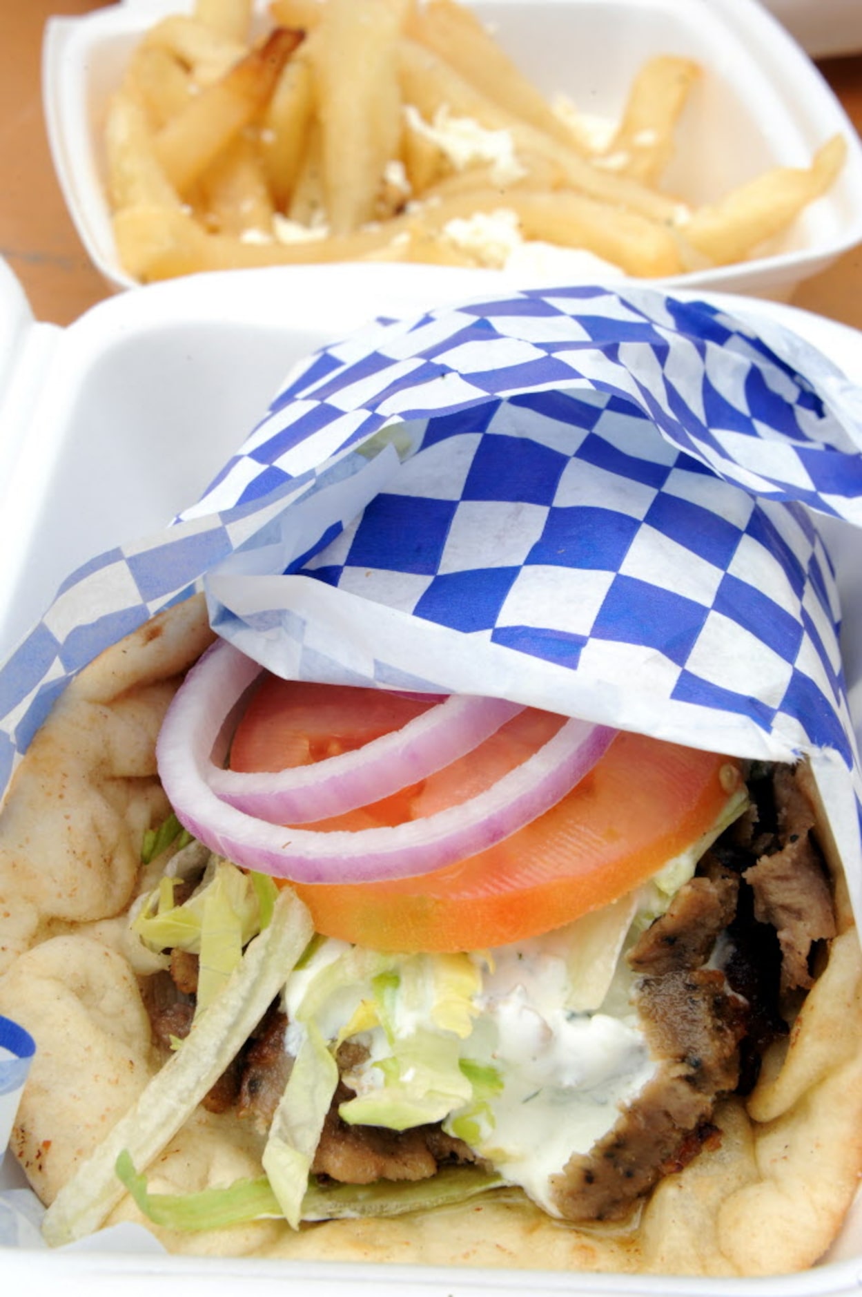 Traditional lamb Gyro from Little Greek food truck with a side of feta cheese fries at the...