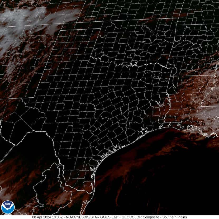 Texas counties on the eclipse's path appear in darkness on this GOES satellite image...