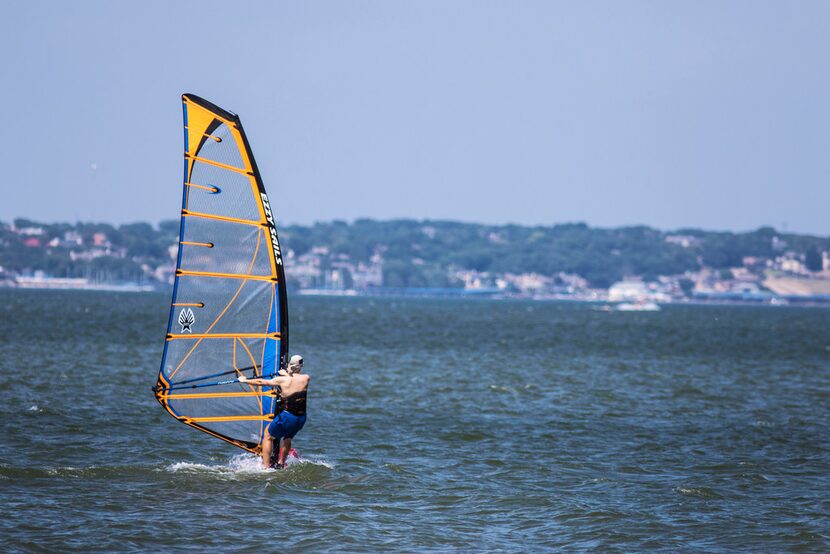 A man windsurfs at Windsurf Bay Park, at Lake Ray Hubbard in Garland. (Carly Geraci/The...