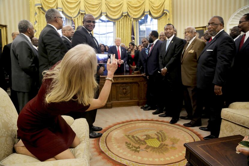 Counselor to the President Kellyanne Conway takes a picture of U.S. President Donald Trump...