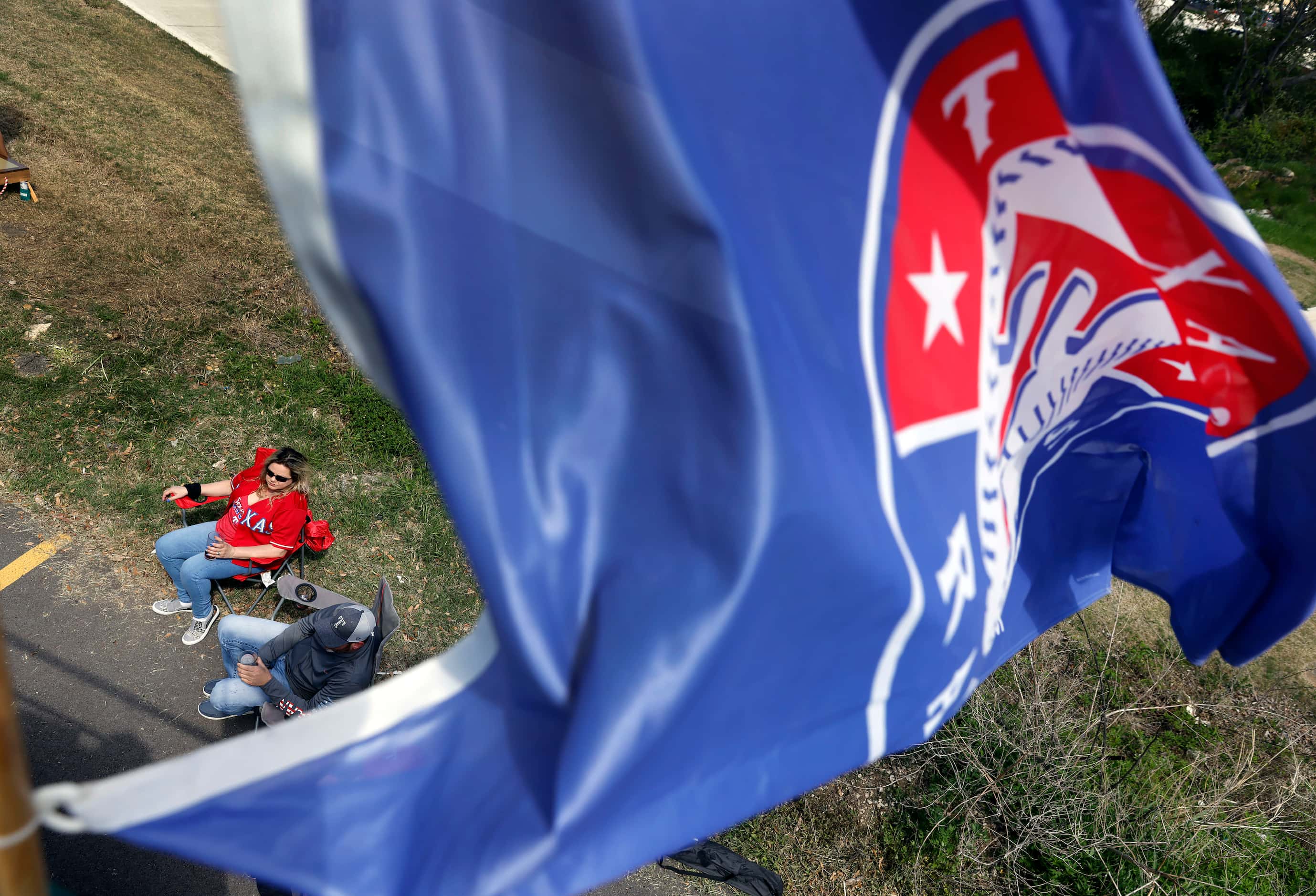 Texas Rangers fans enjoy an Opening Day tailgate party on private property outside of Globe...