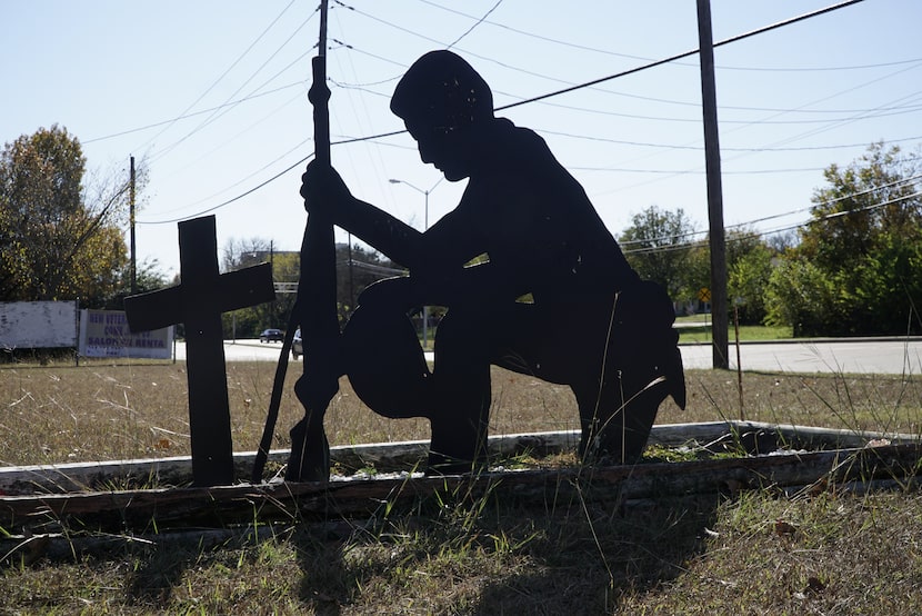 A cutout of a soldier stands near the Hord Cabin at the American Legion Post on Cockrell...