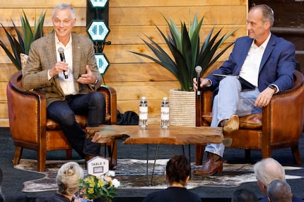 American Airlines President Robert Isom, left, speaks during the Fort Worth Chamber’s annual...