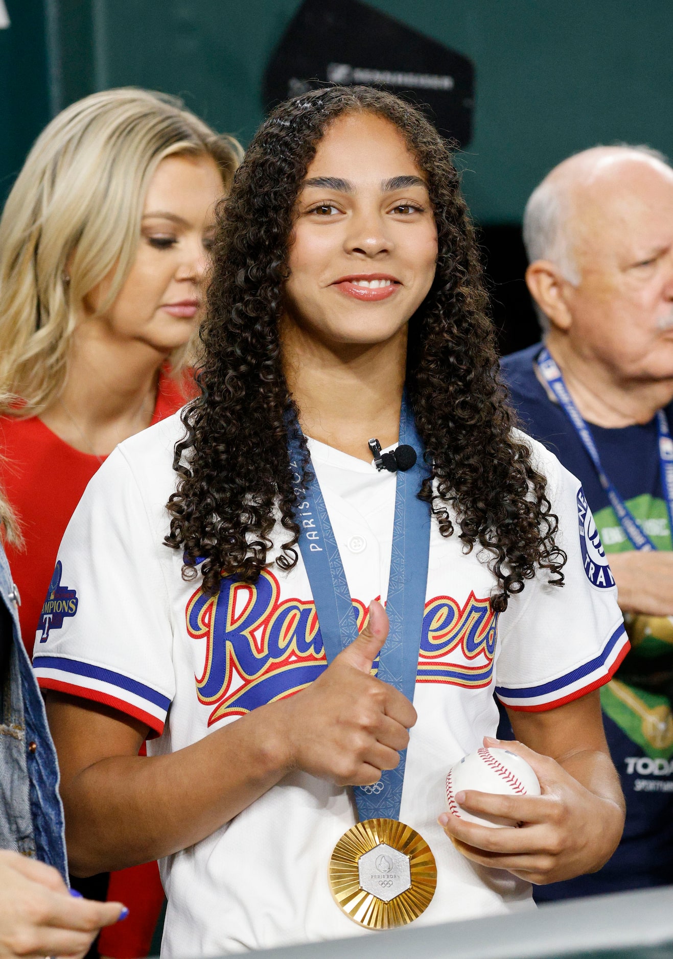 Olympic Gold medalist Hezly Rivera from Plano waits for throwing out a ceremonial first...