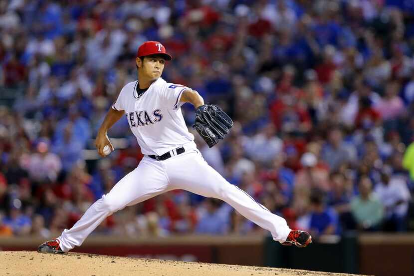 Texas Rangers starting pitcher Yu Darvish (11) throws against the Houston Astros in the...