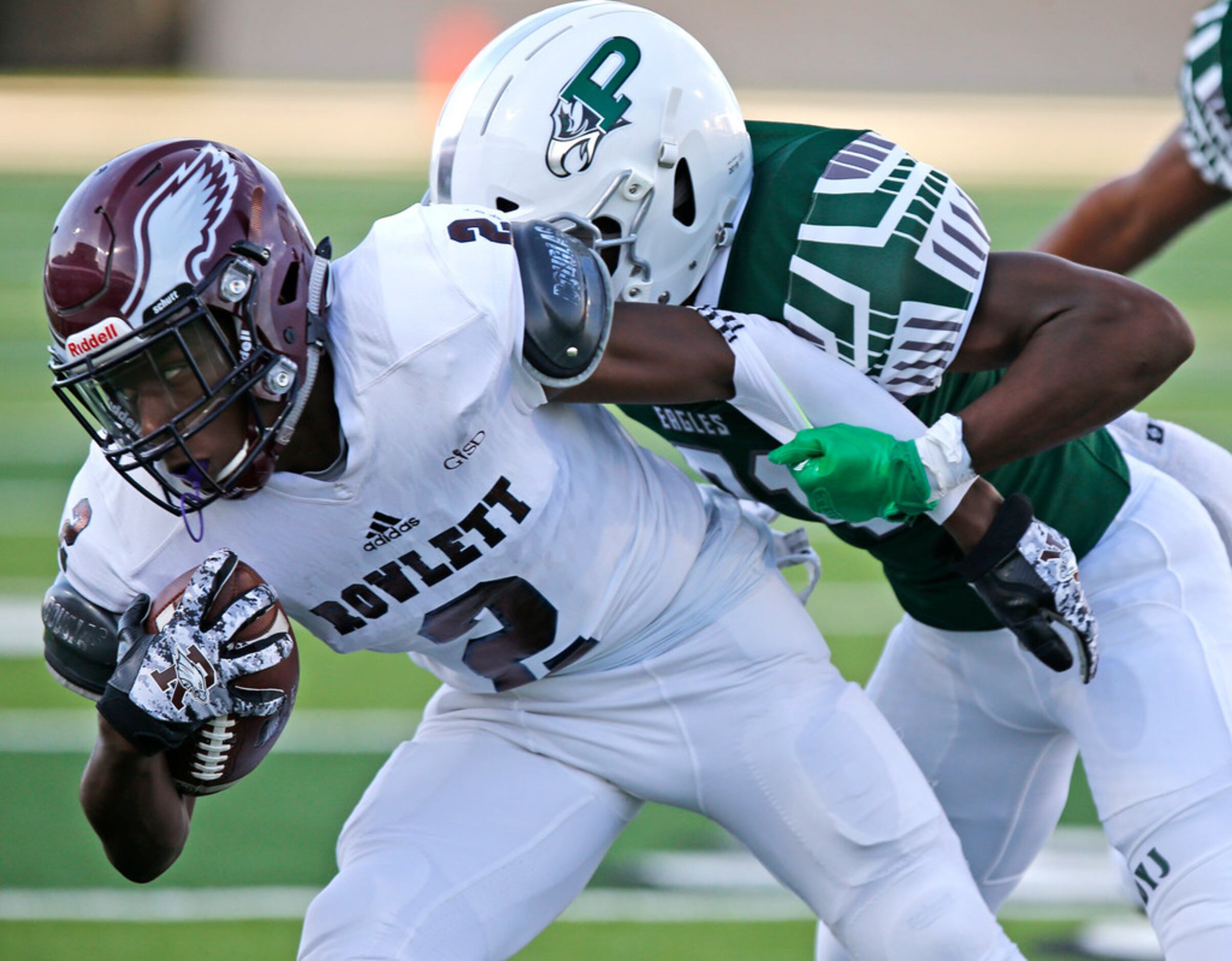 Rowlett High School wide receiver Antonio Hull Jr (2) is tackled by Prosper High School...