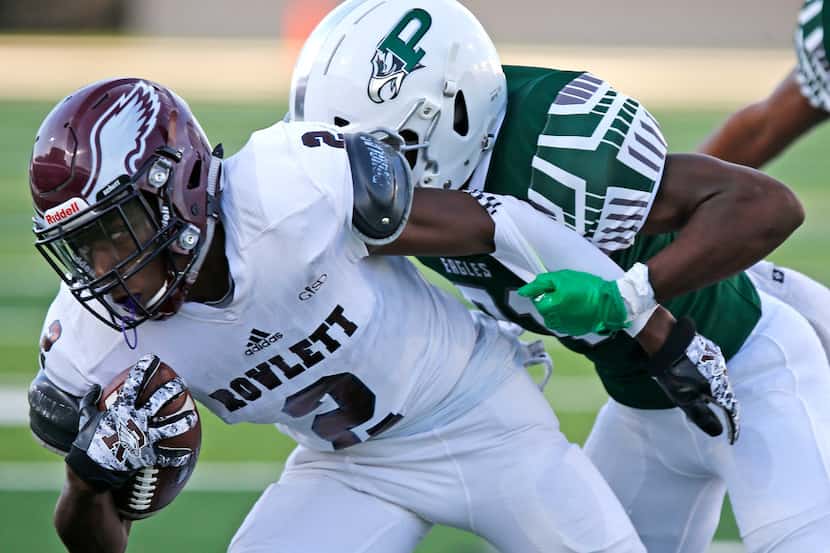 In this file photo, Rowlett High School wide receiver Antonio Hull Jr (2) is tackled by...