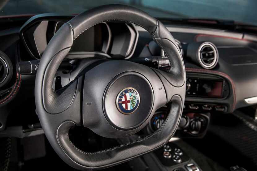 The 2015 Alfa Romeo 4C  sports a flat-bottom steering wheel and a square-shaped instrument...