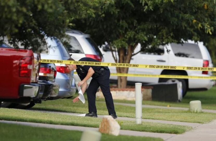 
Frisco police collect evidence on the double homicide, which occurred about 2 a.m. Monday....