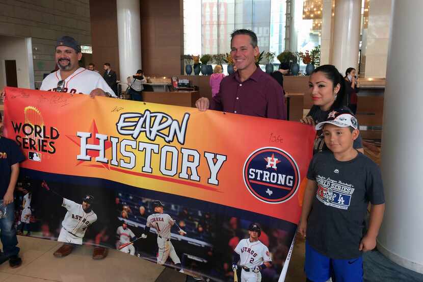 Houston Astros Hall of Fame baseball player Craig Biggio, third from right, poses with...