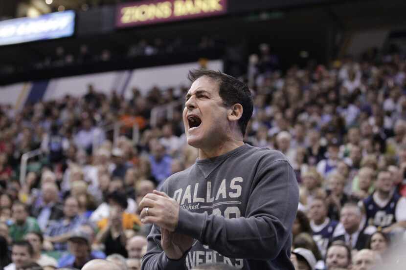 Dallas Mavericks owner Mark Cuban shouts at the referees in the fourth quarter during an NBA...