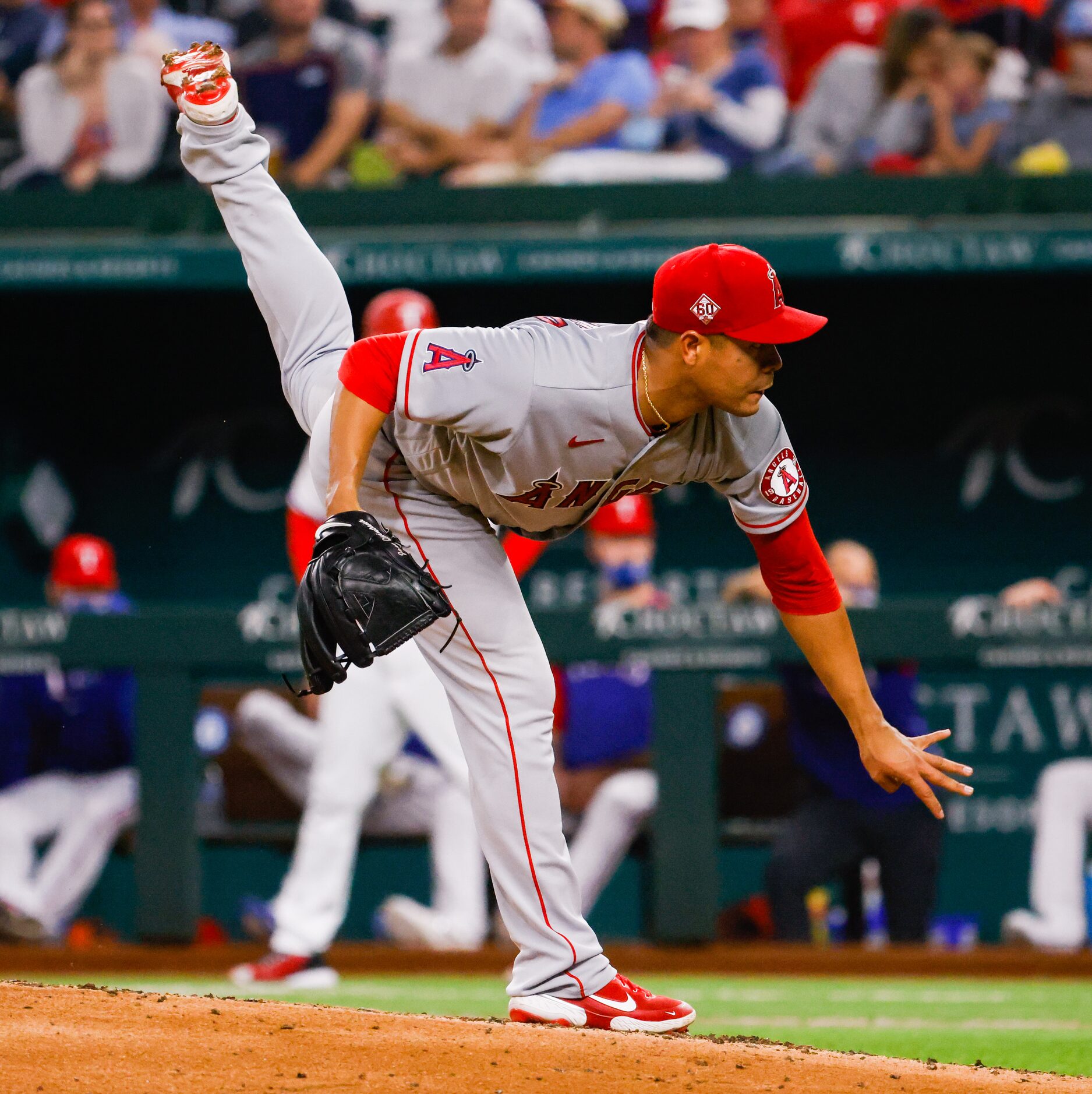 Los Angeles Angels starting pitcher Jose Quintana (62) pitches to the Texas Rangers during...