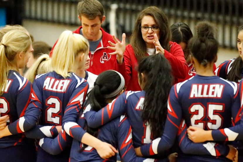 Allen High School coach Kelley Gregoriew talks to her team during a break in the action as...
