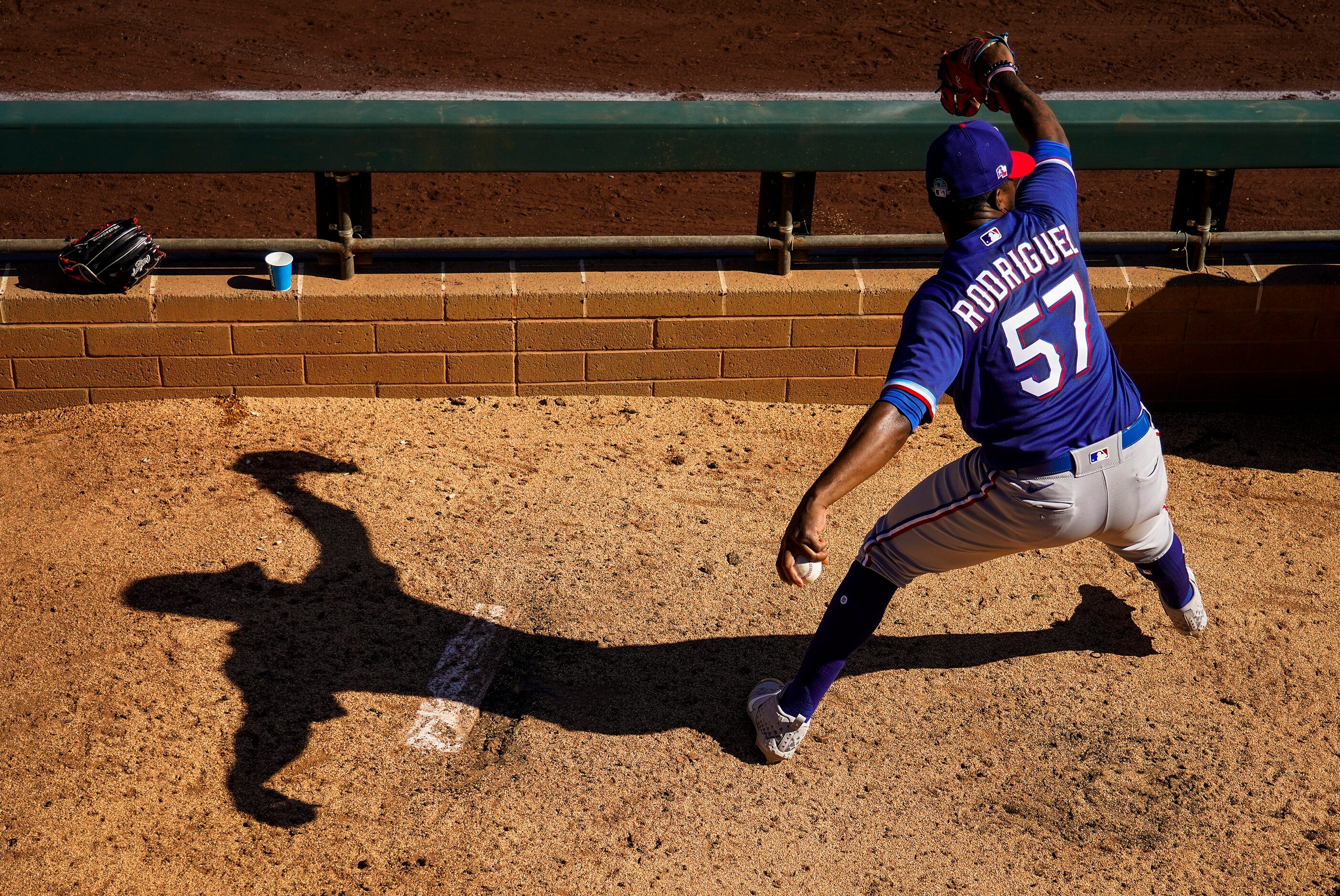 Texas Rangers pitcher Joely Rodriguez warms up in the bullpen during the sixth inning of a...