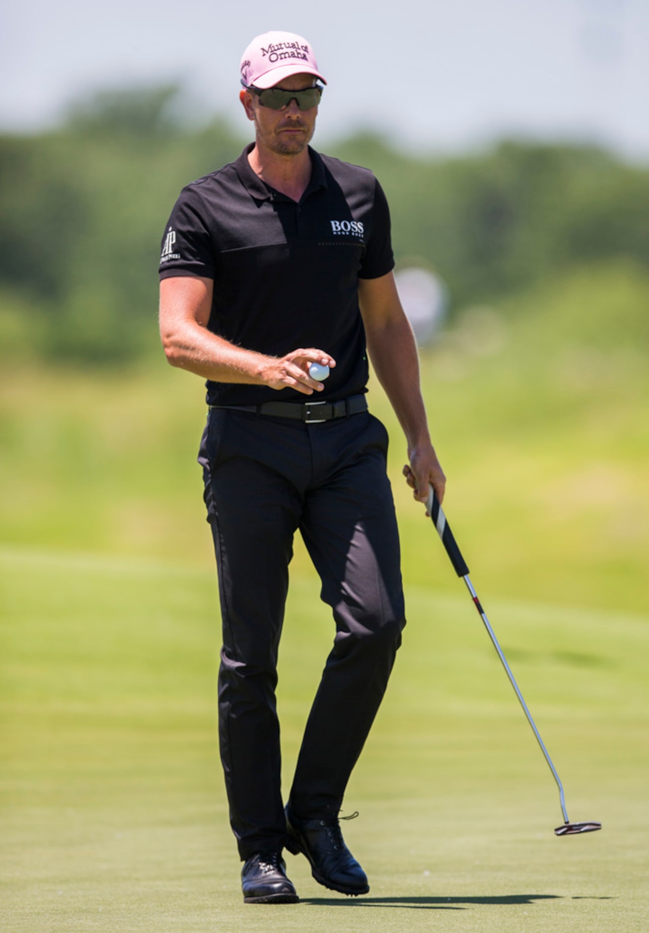 Henrik Stenson waves after sinking a putt on hole 3 during round 4 of the AT&T Byron Nelson...