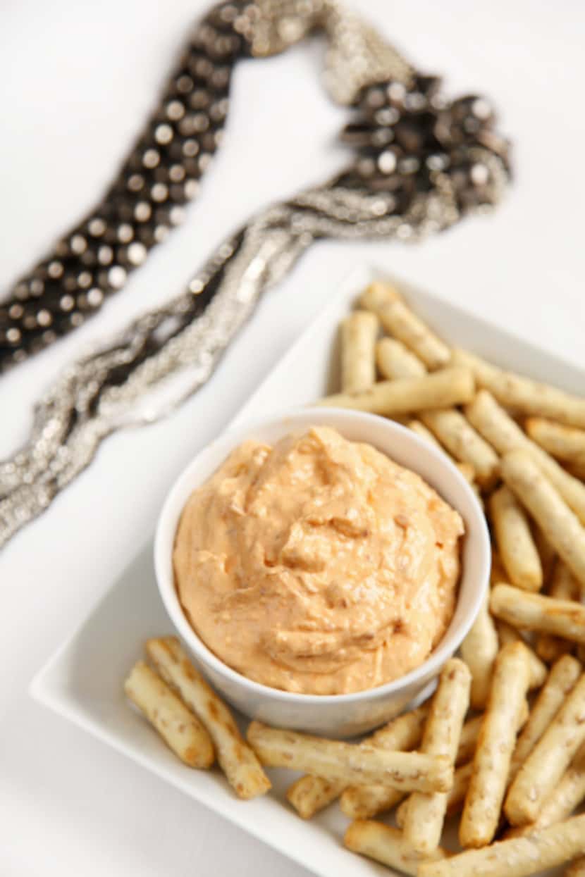 Chipotle-Cheese Dip with Pepperidge Farms Baked Sesame Sticks. Square plate from Napa Home,...