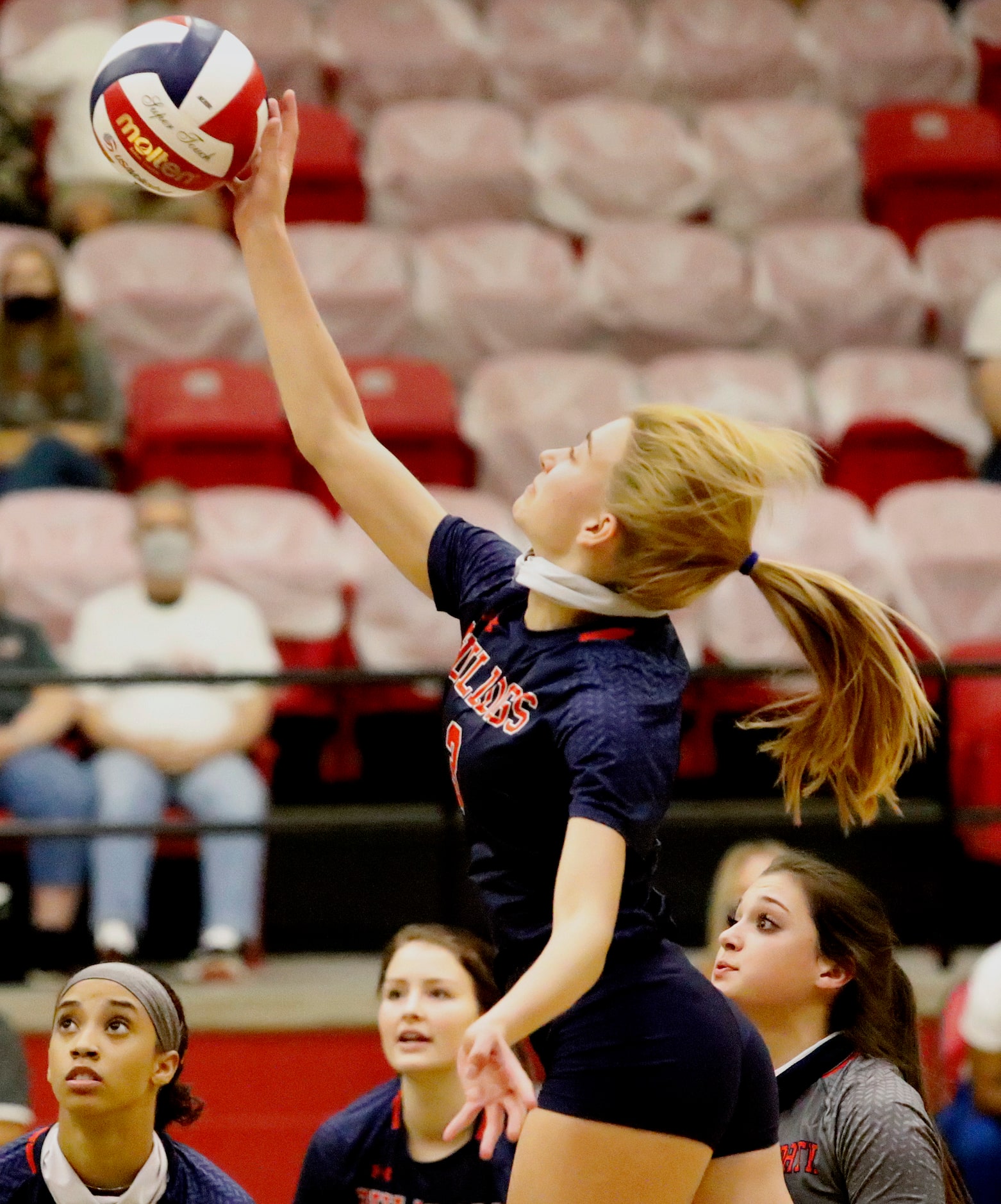 McKinney North High School outside hitter Hallie Collett (3) tips the ball over the net...