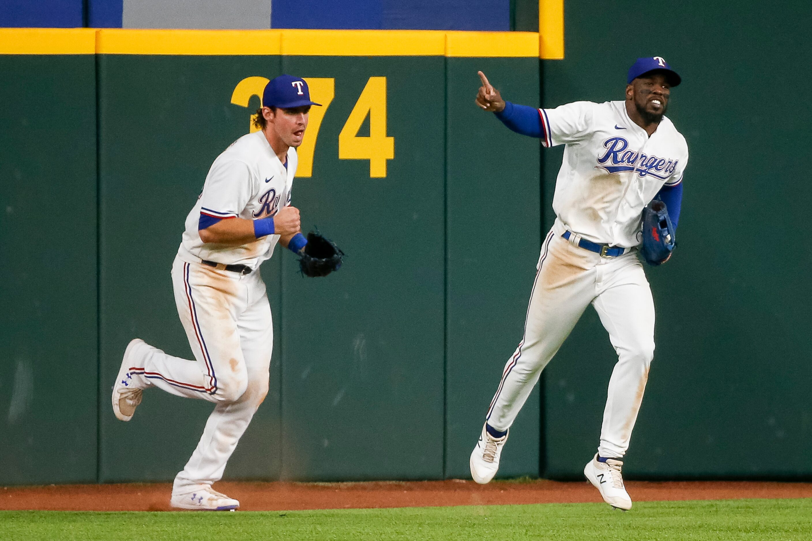 Texas Rangers center fielder DJ Peters (38) and Texas Rangers right fielder Adolis Garcia...