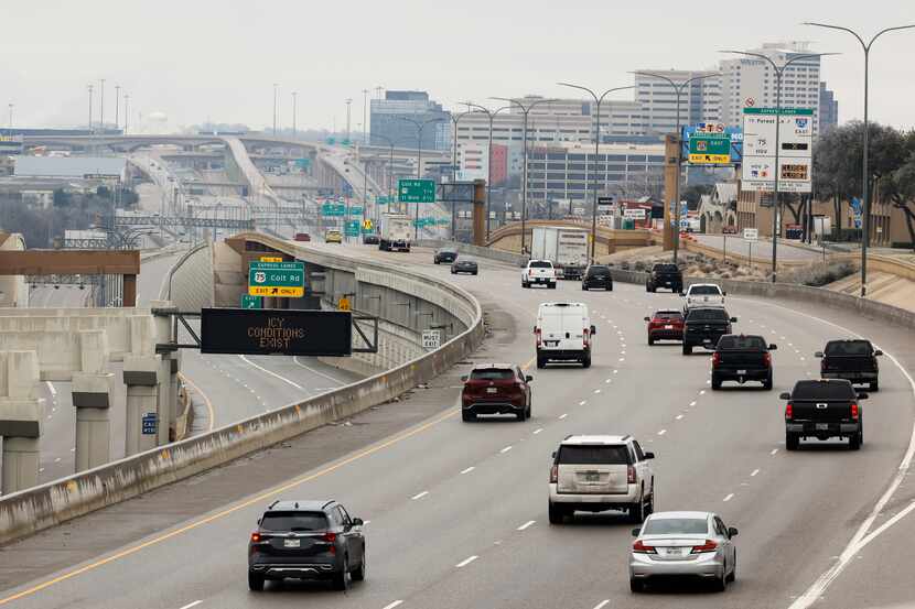 With icy condition, light traffic moves along interstate 635 westbound as express lanes...