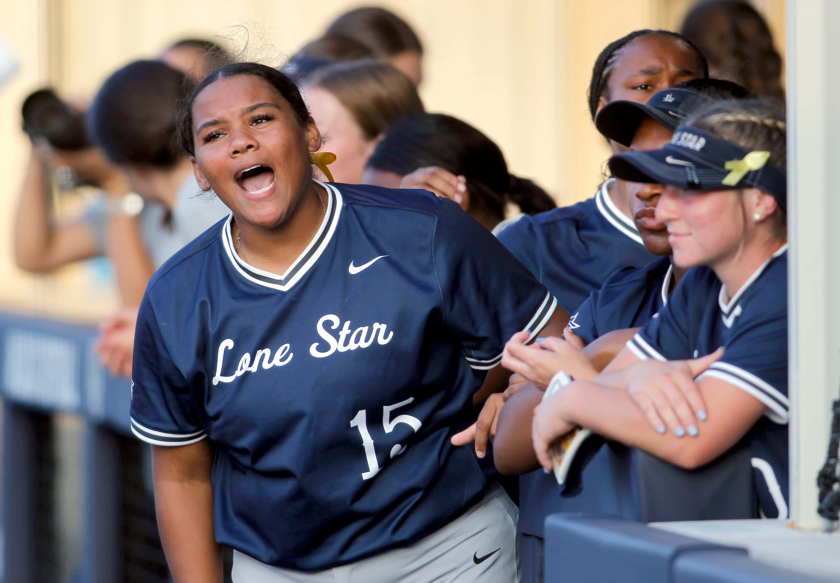 Frisco Lone Star pitcher Audrey Richardson (15) yells encouragement to a teammate at the...