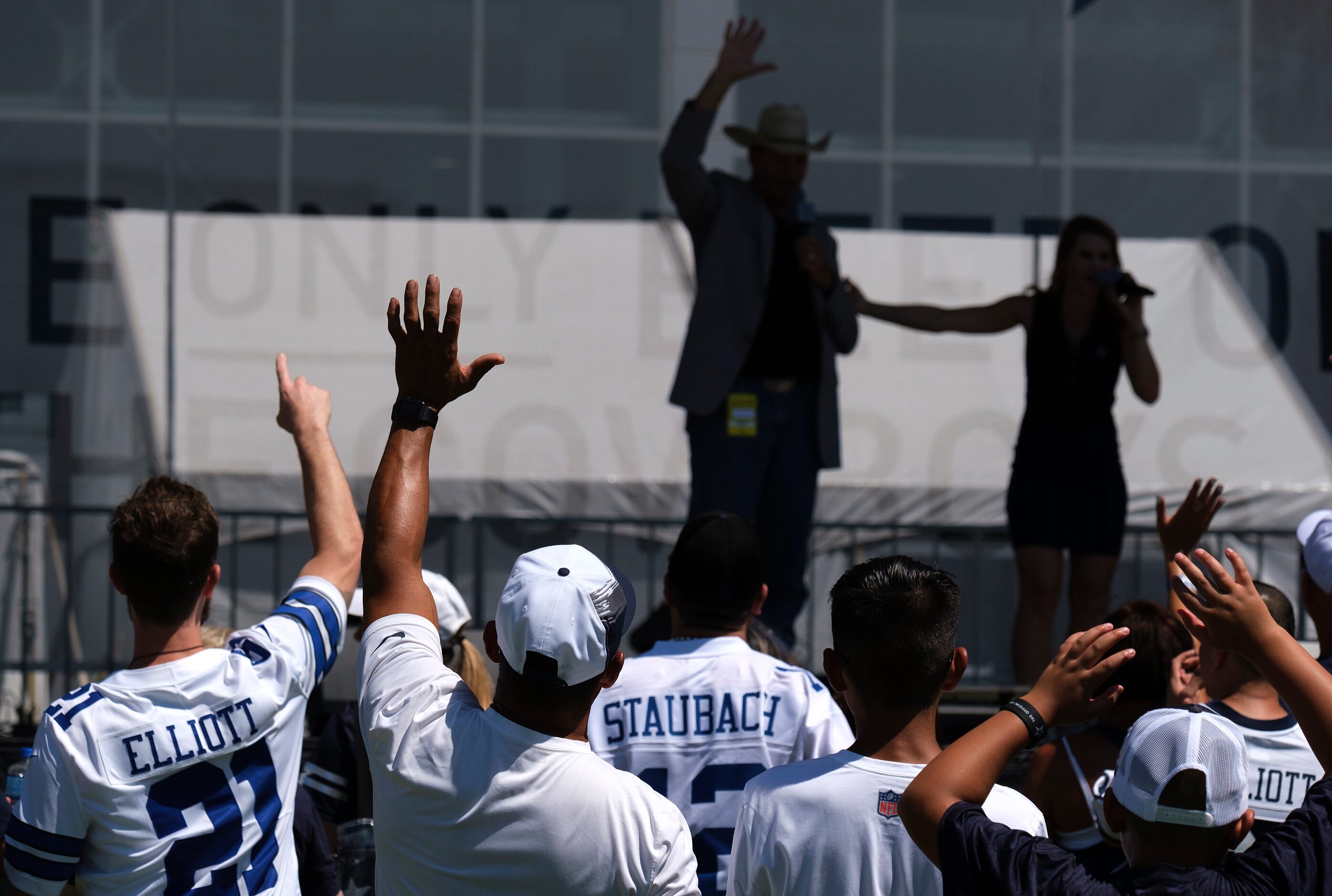 Fans cheer an appearance by former Dallas Cowboys player Jay Novacek before an NFL football...