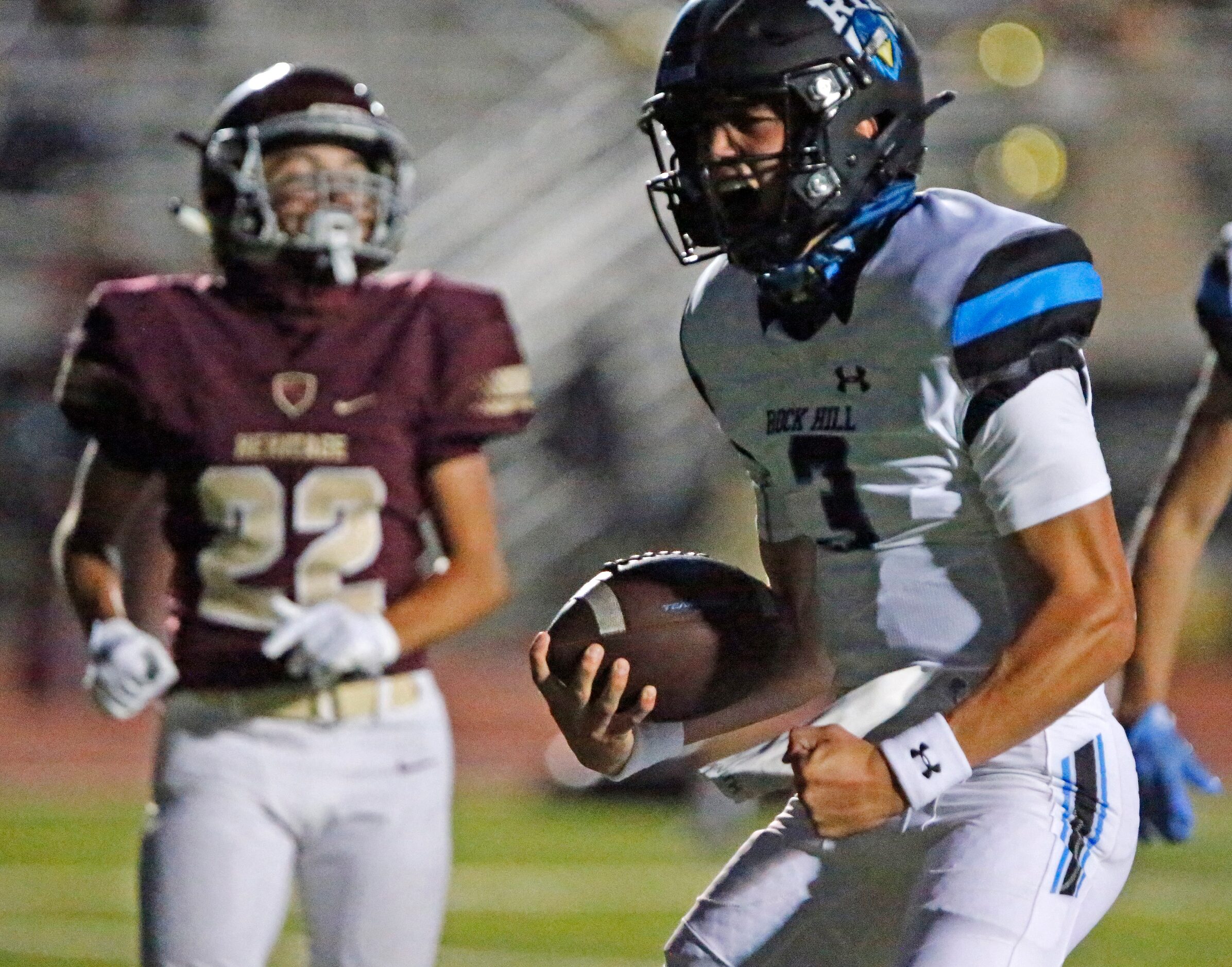 Rock Hill High School quarterback Brenner Cox (3) scores the team’s first touchdown ever...