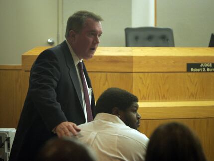 Defense attorney George Milner III, with former Dallas Cowboy Josh Brent in court, credits...